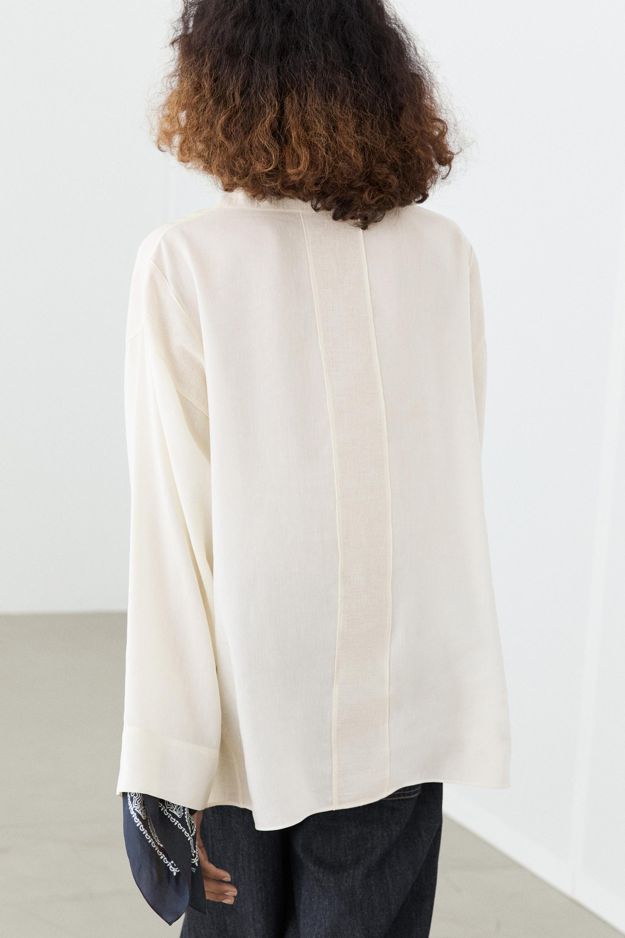 Flowing blouse with seam details